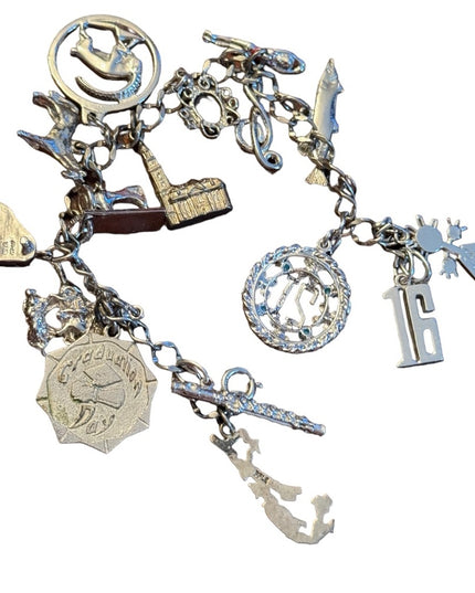 Vintage rhodium plated sterling silver 15 charm link bracelet