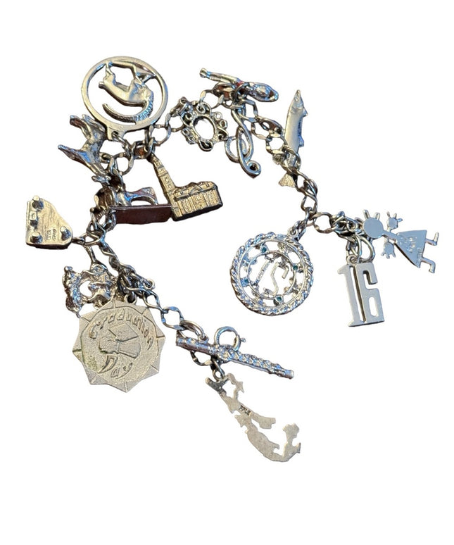 Vintage rhodium plated sterling silver 15 charm link bracelet