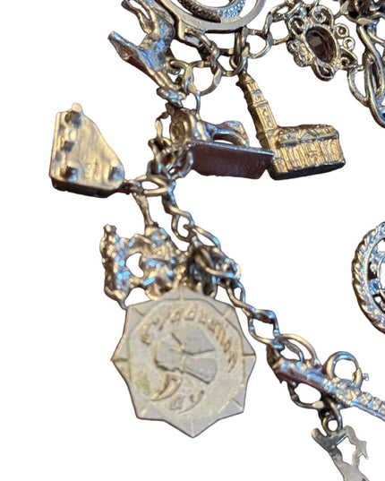 Vintage rhodium plated sterling silver 15 charm link bracelet