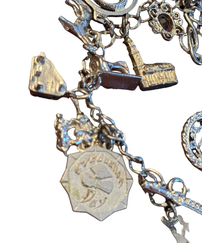 Vintage rhodium plated sterling silver 15 charm link bracelet