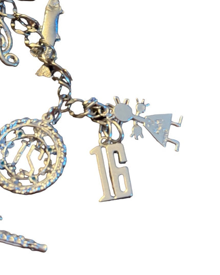 Vintage rhodium plated sterling silver 15 charm link bracelet