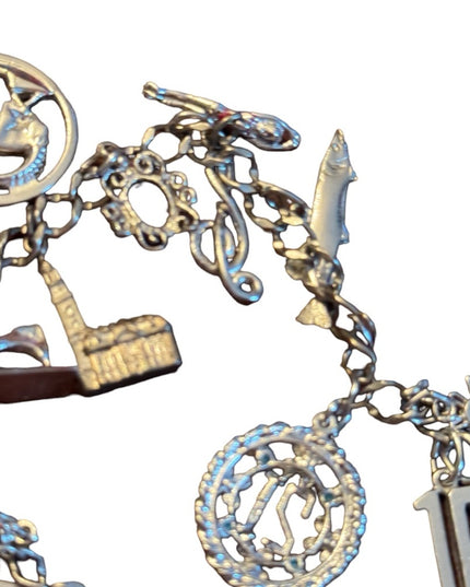 Vintage rhodium plated sterling silver 15 charm link bracelet