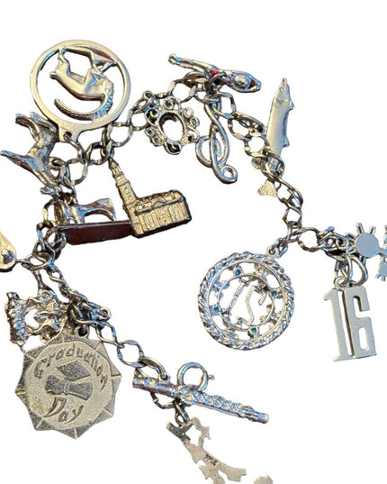 Vintage rhodium plated sterling silver 15 charm link bracelet