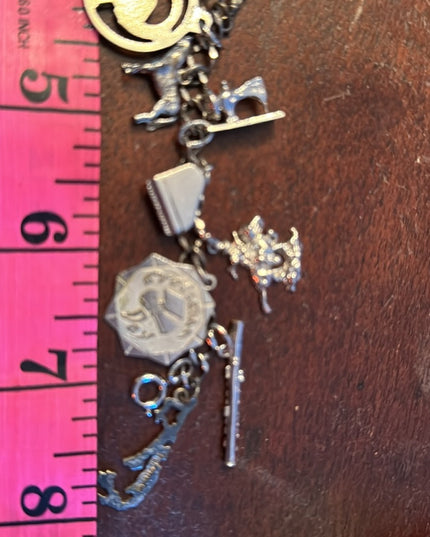 Vintage rhodium plated sterling silver 15 charm link bracelet