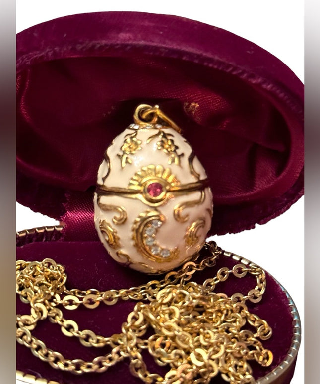 Gold finish creamy enameld crystal embellished Faberge style egg locket necklace