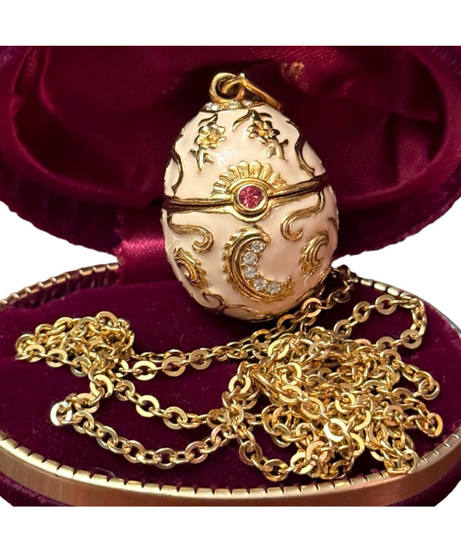 Gold finish creamy enameld crystal embellished Faberge style egg locket necklace