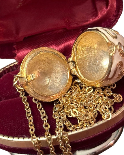 Gold finish creamy enameld crystal embellished Faberge style egg locket necklace