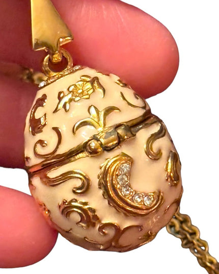 Gold finish creamy enameld crystal embellished Faberge style egg locket necklace