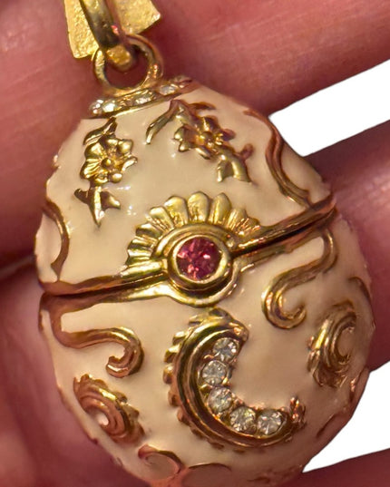 Gold finish creamy enameld crystal embellished Faberge style egg locket necklace