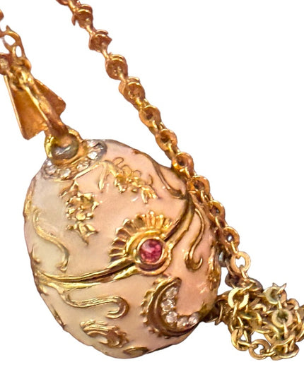 Gold finish creamy enameld crystal embellished Faberge style egg locket necklace