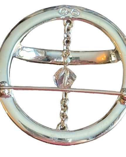 Swarovski gold circle brooch a pave of clear crystal and features a small chain