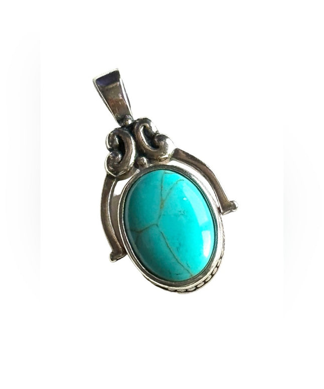 Silver finish southwestern style double side faux turquoise pendant