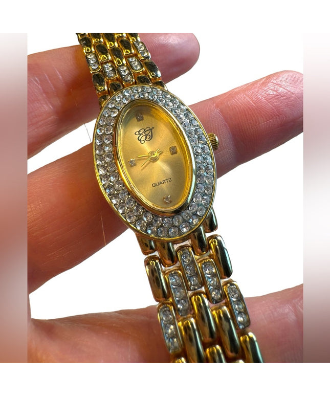#8 Elizabeth Arden oval face gold tone watch rhinestones TICKING 7”