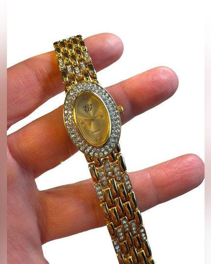 #8 Elizabeth Arden oval face gold tone watch rhinestones TICKING 7”