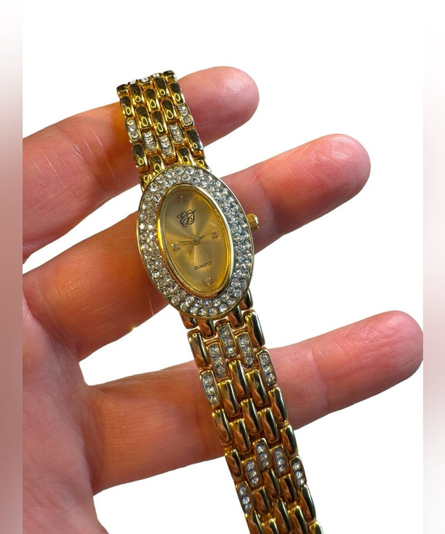 #8 Elizabeth Arden oval face gold tone watch rhinestones TICKING 7”