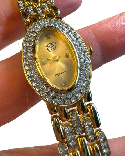#8 Elizabeth Arden oval face gold tone watch rhinestones TICKING 7”