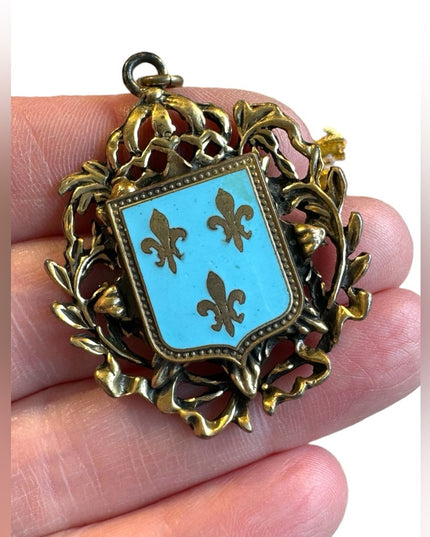 Mid Century Fleur de lis and Shield Goldtone and blue Enamel pendant