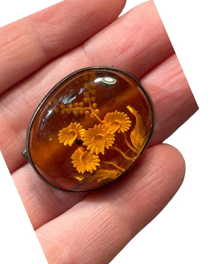 Antique handmade carved flowers encased in amber  fancy silver import