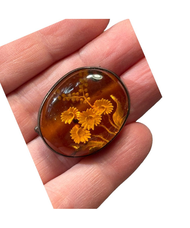 Antique handmade carved flowers encased in amber  fancy silver import