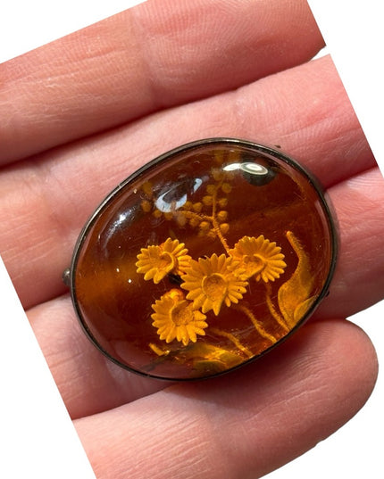 Antique handmade carved flowers encased in amber  fancy silver import