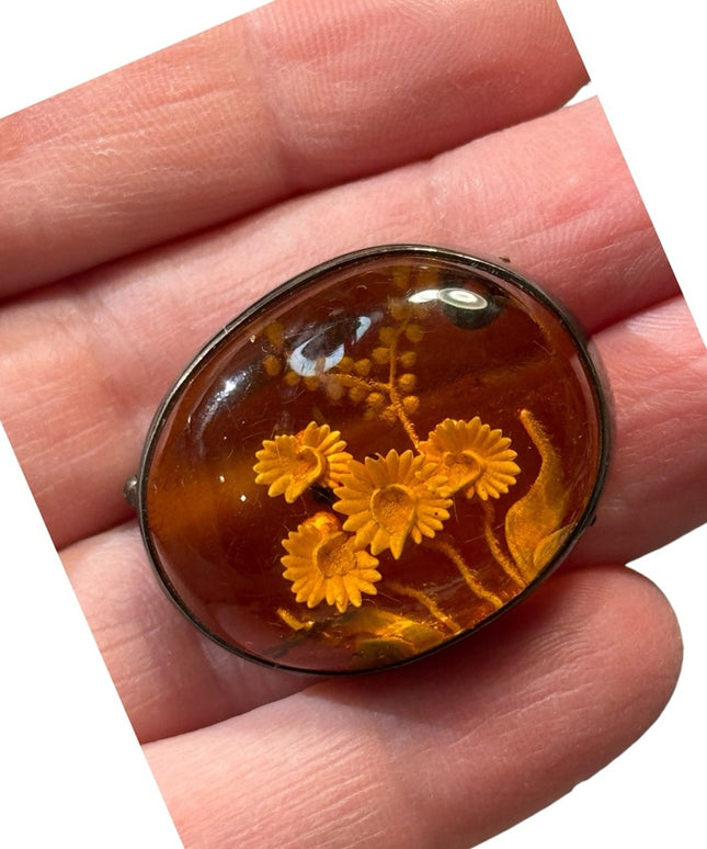 Antique handmade carved flowers encased in amber  fancy silver import