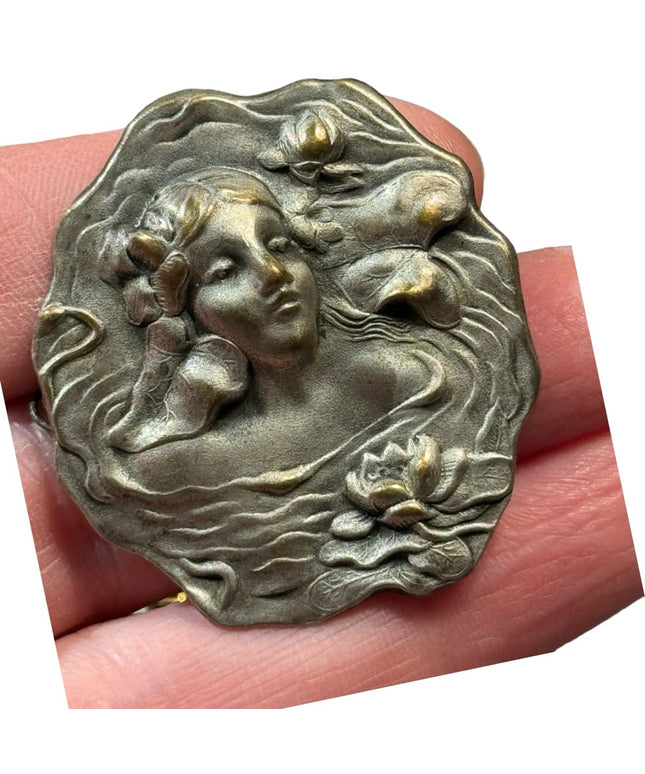 Lovely vintage metal girl with flowers high relief mold brooch