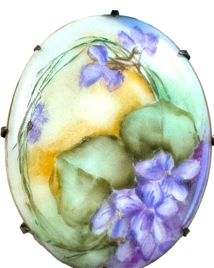 Late Victorian  early 1900's hand painted porcelain brooch  purple violets