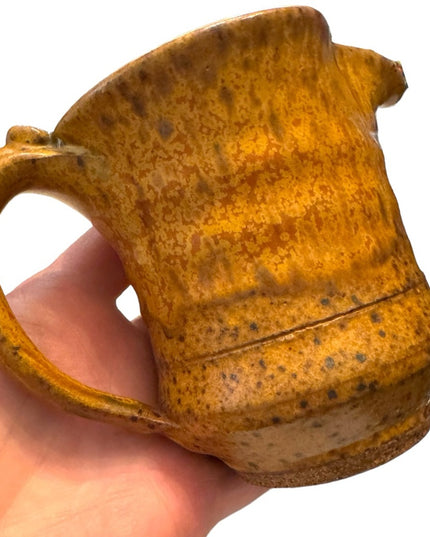 Vintage orange glazed handmade pottery creamer cup