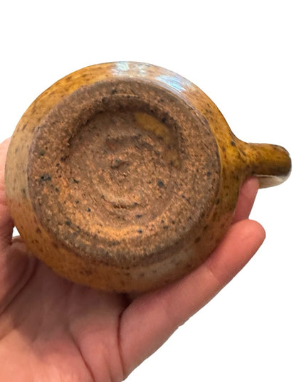 Vintage orange glazed handmade pottery creamer cup
