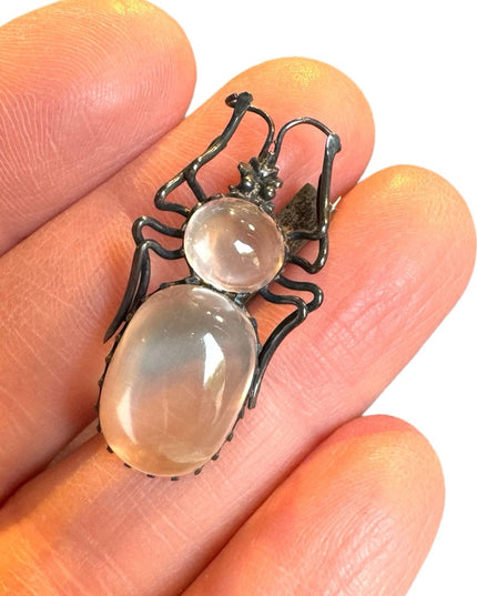A lovely antique moonstone spider brooch silver art deco bug