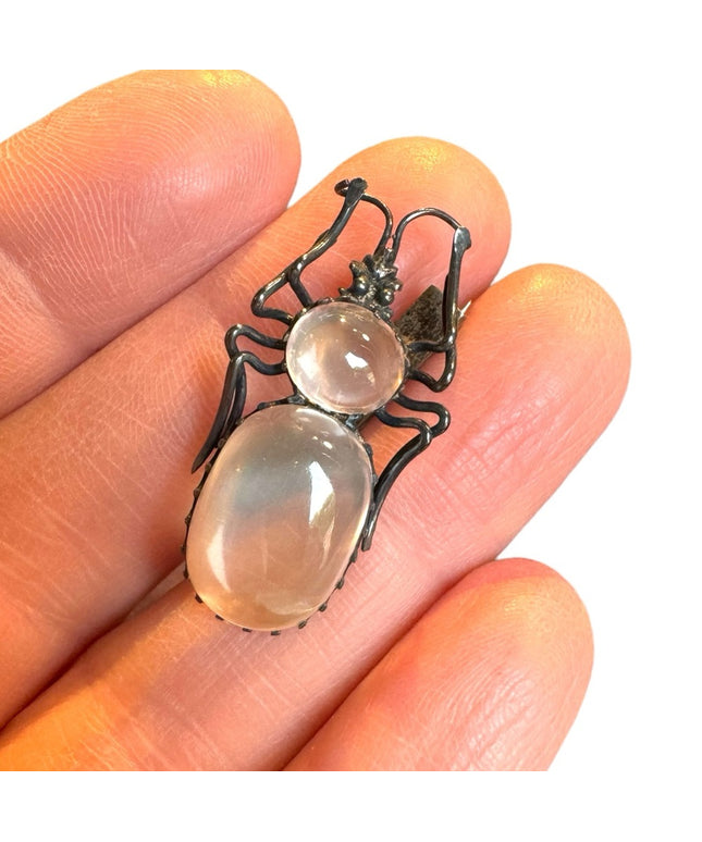 A lovely antique moonstone spider brooch silver art deco bug