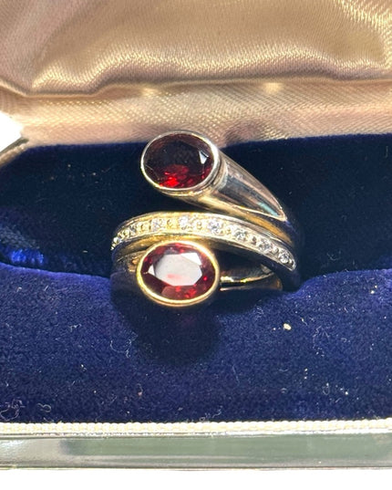 lovely sterking & gold plt Garnet with diamonds twist ring