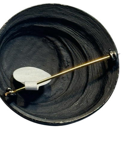 Vintage modernist swirl black enamel round brooch 1960s