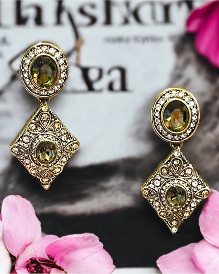 Retired Heidi Daus antiqued brassy finish peridot green & clear crystal …