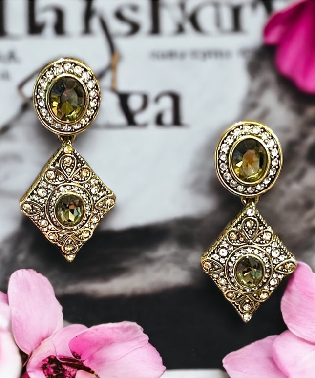 Retired Heidi Daus antiqued brassy finish peridot green & clear crystal …